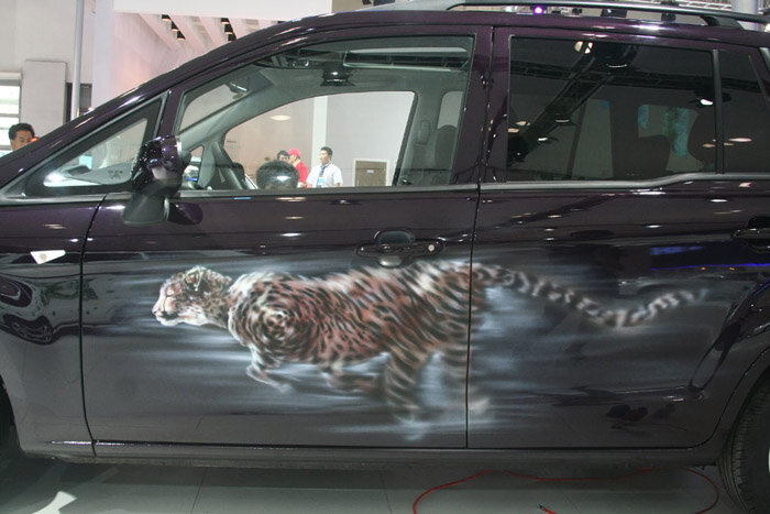 Black SUV airbrushed with a tiger
